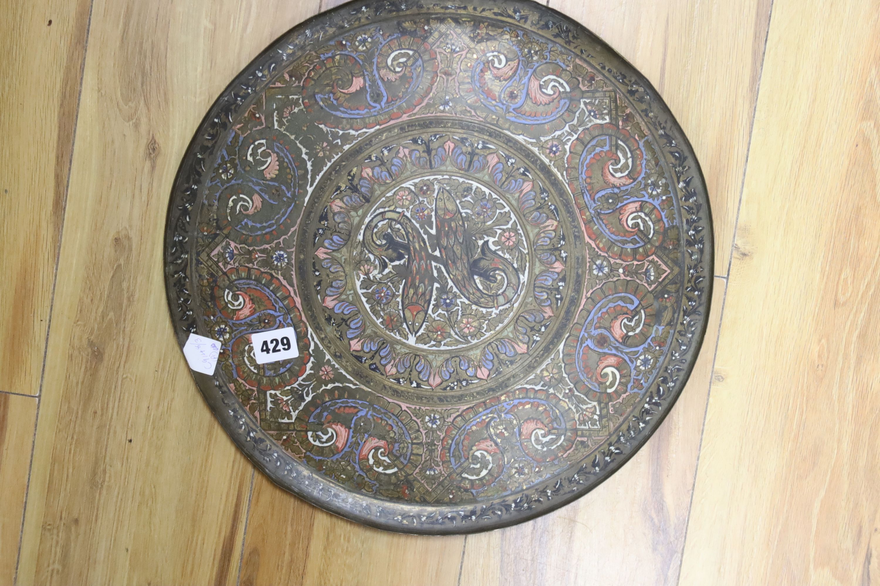 A pair of Islamic enamelled brass trays, diameter 38cm